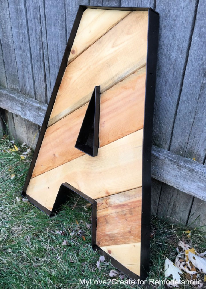 Rustic industrial letter on wooden pallets