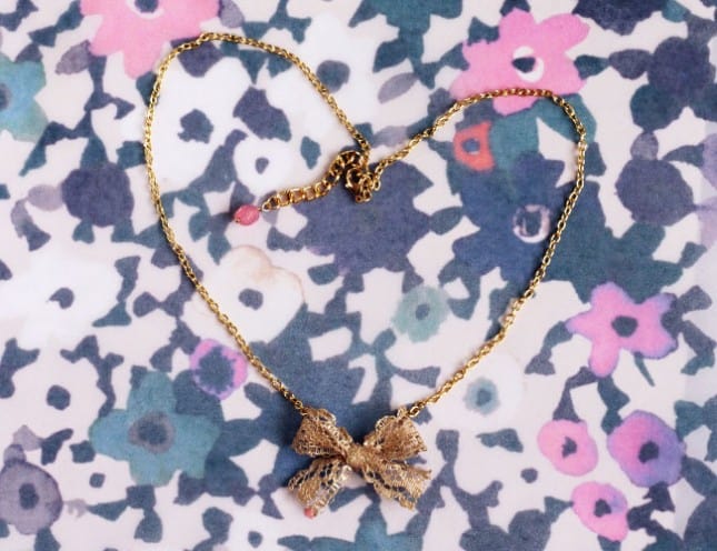 Anthropologie-style gold-plated lace bow necklace