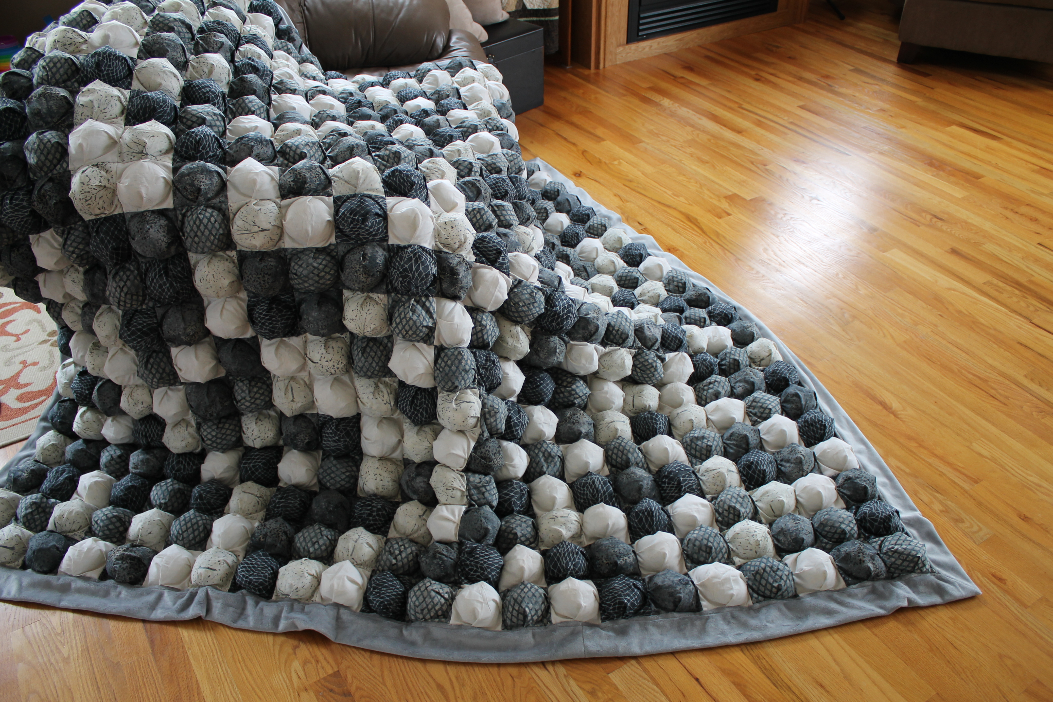 white and grey bubble quilt